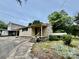 Tan wood-sided home featuring a small front porch and mature landscaping at 1733 S Nc 16 Business Hwy, Stanley, NC 28164