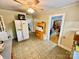 View of the spacious kitchen with tile flooring and a white refrigerator at 1733 S Nc 16 Business Hwy, Stanley, NC 28164
