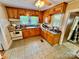 Traditional kitchen featuring wood cabinets, neutral countertop, and basic appliances at 1733 S Nc 16 Business Hwy, Stanley, NC 28164