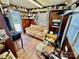 Small living room with wood paneling, and a mix of furnishings at 1733 S Nc 16 Business Hwy, Stanley, NC 28164