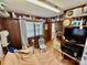 Small living room with wood paneling, and a mix of furnishings at 1733 S Nc 16 Business Hwy, Stanley, NC 28164