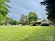 Exterior shot of a home with a very large, well-manicured front yard at 1733 S Nc 16 Business Hwy, Stanley, NC 28164