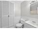 Cozy bathroom featuring a toilet, sink, and mirrored vanity plus ample storage at 1812 Alpine Dr, Kings Mountain, NC 28086