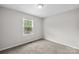 Neutral bedroom with plush carpet and a window offering ample natural light at 1812 Alpine Dr, Kings Mountain, NC 28086