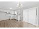 White kitchen features wood-look flooring, white cabinets, and a window over the sink at 1812 Alpine Dr, Kings Mountain, NC 28086