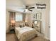 Cozy bedroom virtually staged with a ceiling fan, neutral decor, and a comfortable bed setting at 2015 Downey St, Rock Hill, SC 29732