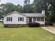 Lovely home with manicured lawn, classic siding, and black shutters enhancing curb appeal and style at 2015 Downey St, Rock Hill, SC 29732