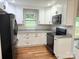 Bright kitchen with updated white cabinetry, granite countertops, and modern black appliances, perfect for cooking at 2015 Downey St, Rock Hill, SC 29732