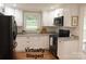 Bright staged kitchen with stainless steel appliances and granite countertops at 2015 Downey St, Rock Hill, SC 29732