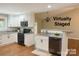 Updated staged kitchen featuring stainless steel appliances, granite countertops, and hardwood floors at 2015 Downey St, Rock Hill, SC 29732
