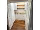 Well organized laundry room with custom shelving and hardwood floors at 2015 Downey St, Rock Hill, SC 29732