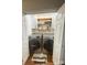 Staged laundry room with washer and dryer and custom shelving at 2015 Downey St, Rock Hill, SC 29732
