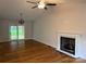 Bright living room with hardwood floors, vaulted ceiling, fireplace and sliding glass doors to the backyard at 2015 Downey St, Rock Hill, SC 29732