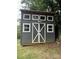 A well-maintained outbuilding, perfect for storage or workshop, featuring a unique design with multiple windows at 2015 Downey St, Rock Hill, SC 29732