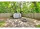 Backyard features a storage shed and a fire pit for outdoor enjoyment at 203 Lincoln St, Belmont, NC 28012