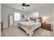 Inviting bedroom with a large bed, neutral colors, and natural light from two windows at 203 Lincoln St, Belmont, NC 28012