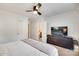 Spacious bedroom with a large bed, ceiling fan, walk in closet, and ensuite bathroom at 203 Lincoln St, Belmont, NC 28012