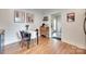 Cozy dining area featuring hardwood floors, table with seating, and decorative artwork at 203 Lincoln St, Belmont, NC 28012