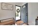 Welcoming entryway with a stylish door and wood floors at 203 Lincoln St, Belmont, NC 28012
