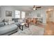 Inviting living room with a decorative rug and a view of the entryway at 203 Lincoln St, Belmont, NC 28012