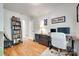 Well-appointed office space with built in bookcase, hardwood floors, and a comfortable workspace at 203 Lincoln St, Belmont, NC 28012