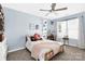 Cozy bedroom features a twin bed, carpeted floors and light-filled window at 2210 Winding River Dr, Charlotte, NC 28214