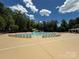 Large community pool with plenty of lounge chairs and a water slide at 2210 Winding River Dr, Charlotte, NC 28214