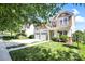 Traditional two-story home with a two-car garage and manicured lawn with lush green foliage at 2210 Winding River Dr, Charlotte, NC 28214