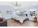Serene bedroom featuring a neutral color palette, fan, and ample natural light at 2210 Winding River Dr, Charlotte, NC 28214
