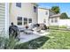Back patio featuring outdoor seating and dining areas with grill, perfect for enjoying the outdoors at 2210 Winding River Dr, Charlotte, NC 28214