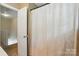 Bathroom featuring a doorway and shower with curtain at 2234 Dion Ave, Charlotte, NC 28212