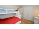 Comfortable bedroom features a bunk bed, closet and a nightstand with lamp at 2234 Dion Ave, Charlotte, NC 28212