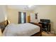 Comfortable bedroom with vaulted ceiling, carpet flooring and work space at 2234 Dion Ave, Charlotte, NC 28212