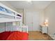Comfortable bedroom features a bunk bed, closet, nightstand and ceiling fan at 2234 Dion Ave, Charlotte, NC 28212