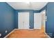 This bedroom features a ceiling fan and a storage closet at 2234 Dion Ave, Charlotte, NC 28212