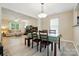 Dining area view into the adjacent living room filled with natural light at 2234 Dion Ave, Charlotte, NC 28212
