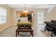 Open dining area featuring light wood floors and a view into the kitchen at 2234 Dion Ave, Charlotte, NC 28212