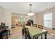 Bright dining area with a large window and a view into the adjacent living room at 2234 Dion Ave, Charlotte, NC 28212