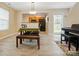 Dining area with a modern light fixture and open access to the kitchen area at 2234 Dion Ave, Charlotte, NC 28212