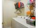 Laundry area with washer, dryer, storage shelves and standard walls at 2234 Dion Ave, Charlotte, NC 28212