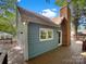 Charming home exterior featuring a brick chimney, wood siding, and inviting deck space at 2312 Christensens Ct, Charlotte, NC 28270