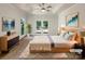 Tranquil main bedroom showcasing tray ceiling, french doors to deck and contemporary furniture at 2312 Christensens Ct, Charlotte, NC 28270