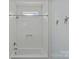Modern bathroom with white subway tile, tub, shower, and decorative starfish accents at 2315 Winthrop Ave, Charlotte, NC 28203