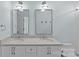 Well-lit bathroom with dual sinks, modern mirrors, and sleek fixtures for a comfortable and stylish experience at 2315 Winthrop Ave, Charlotte, NC 28203
