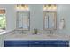 Modern bathroom with double vanity, marble countertop, blue cabinets, and updated fixtures at 2315 Winthrop Ave, Charlotte, NC 28203