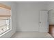 Bright bedroom with neutral carpet, a window with a woven shade, and ample natural light at 2315 Winthrop Ave, Charlotte, NC 28203