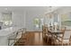 Elegant dining area with a chandelier, hardwood floors, and seamless access to the kitchen area at 2315 Winthrop Ave, Charlotte, NC 28203