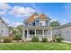 Charming blue two-story home with a large front porch and well-manicured lawn at 2315 Winthrop Ave, Charlotte, NC 28203