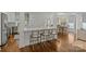 Open kitchen layout with counter seating, modern appliances, and seamless flow into the dining room at 2315 Winthrop Ave, Charlotte, NC 28203