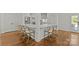 Spacious kitchen island featuring white countertops and stylish bar stool seating, ideal for entertaining guests at 2315 Winthrop Ave, Charlotte, NC 28203